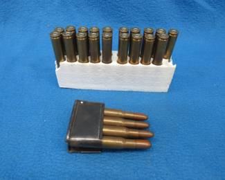 Lot 31. 27 unidentified rounds (possibly 8mm) with one M1 Garand en bloc clip