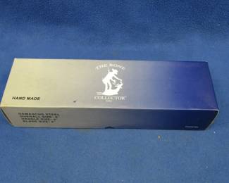 Lot 198. Hand-made Bone Collector Damascus steel 8" knife with a 4" blade and a sheath in the box