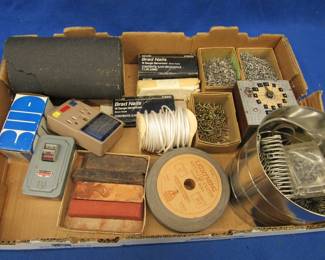 Lot 174. Garage goodies: copper wire, springs, tiny screws, brass pump, pick ax head, and more
