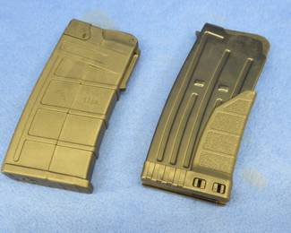 Lot 118. Two 12-gauge magazines for an unknown shotgun model