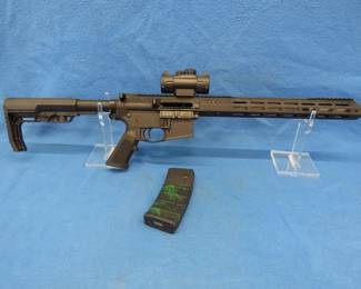 Lot 12. American Tactical AR-15 semi-auto rifle. S/N MSA107133. Multi-caliber. 18 inches fluted stainless steel barrel with a Red Dot scope.