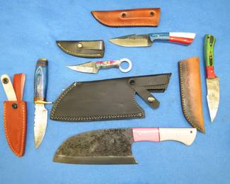 Lot 142. Five new knives with leather sheaths