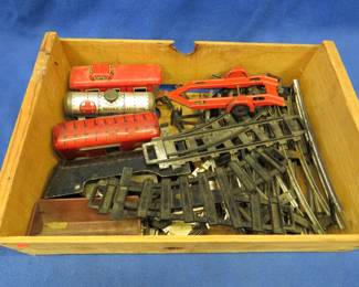 Lot 365. Marx toy train for parts or repair with track in a wooden peach crate.