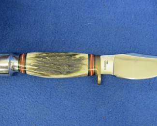 Lot 205. Like-new Steel Warrior 440 stainless fixed blade knife in a tin presentation box