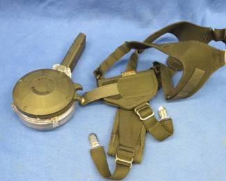Lot 41. KCI 40 S&W, 50-round drum mag, and an Uncle Mike's Sidekick shoulder holster