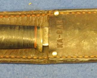Lot 285. KA-BAR fixed-blade knife with leather sheath