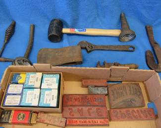 Lot 148. Oil spout, NOS coils, printing plates, ax head, and old tools