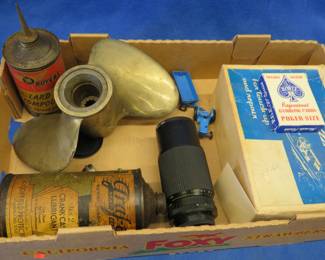 Lot 302. Brass prop, vintage oil containers, and more