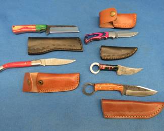 Lot 258. Five new knives with leather sheaths