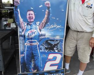 Lot 401. Cardboard sign of NASCAR driver Kurt Busch advertising Miller Lite Beer