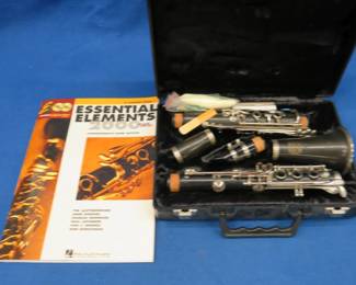 Lot 114. Lafayette clarinet in a case and a music book