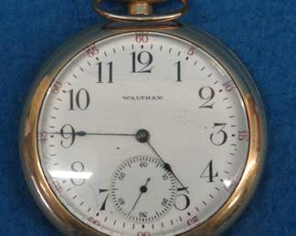 Lot 14. Waltham 15 jewel pocket watch in a 14 kt gold-filled Nawco King case. Movement #17475623. Case #7268636. Not working.