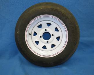 Lot 394. Unused Carlisle 4-hole trailer tire. 5.30-12.