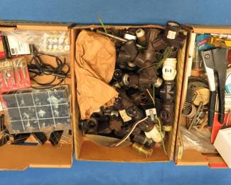 Lot 221. Three flats of garage/shop misc.