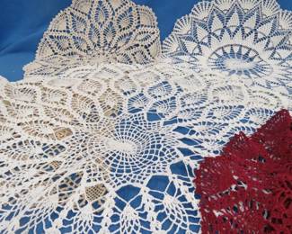 Lot 141. Crocheted doilies, candles and more