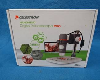 Lot 119. New in the box Celestron digital microscope