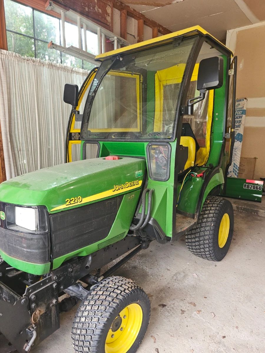 AVAILABLE FOR PRESALE John Deere 2210 HST 4WD Compact Utility Tractor Package This well-maintained John Deere tractor shows approximately 383 hours and includes everything needed to tackle Michigan winters and year-round property maintenance. Package includes: • John Deere 2210 HST 4WD compact tractor • Curtis enclosed cab with doors and mirrors • Cab heater/defroster • John Deere front-mounted snowblower • Frontier RB2060 60-inch rear blade • Good tires and clean, complete interior Presale Price: $12,500 or best reasonable offer