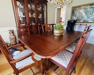 Dining table with 2 leafs and 8 chairs and a Palmer Homes Lexington Homes China closet