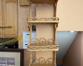 Vintage Rattan Four-Tier Wall Shelf with Scrollwork Crest