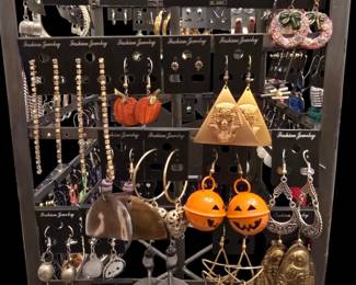 Assorted Fashion Jewelry Earring Collection on Rotating Display Stand with Seasonal Themes