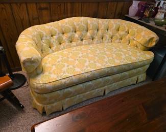 Drexel, vintage curved-back loveseat featuring yellow floral damask upholstery and classic button tufting.
