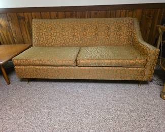 sectional vintage mid-century modern single-arm tufted sofa featuring a burnt orange and green floral brocade or damask pattern. Right side sofa.