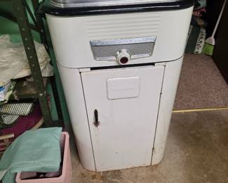 vintage 1950s Westinghouse Electric Roaster Oven mounted on its matching rolling storage cabinet base