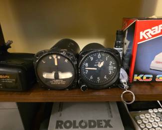 vintage aircraft turn and slip indicator (also known as a turn and bank indicator.vintage aircraft altimeter, likely manufactured by Kollsman or a similar aviation instrument maker from the mid-20th century
