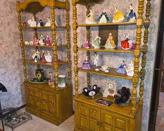 Two, vintage medium-oak five-tier display shelf and cabinet featuring ornate spindle-turned posts and an arched carved crest