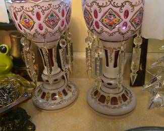 pair of antique Bohemian or Victorian white-overlay cut-to-cranberry glass mantel lusters adorned with hanging crystal prisms