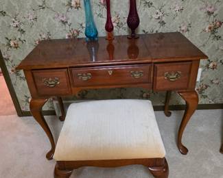 -style wooden dressing vanity featuring a convenient flip-up center mirror and a matching upholstered stool.
