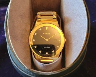 Citizen solar power gold watch