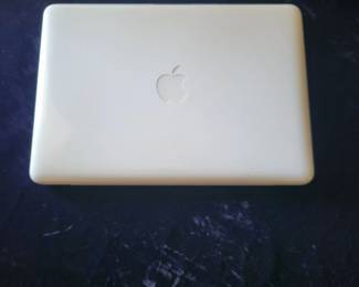 Apple laptop macbook with charging cable