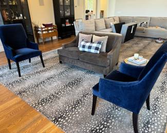 Two Williams-Sonoma midnight blue Belvedere dining armed chairs, upholstered in "performance velvet". These are very nice anti-tip "dining" chairs, incredibly comfortable!