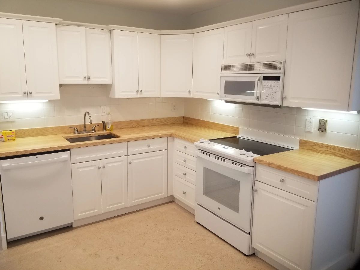 Updated kitchen cabinetry - plenty of upper & lower cabinets