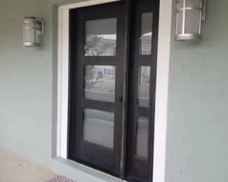 Elegant entry door; stylish exterior lights