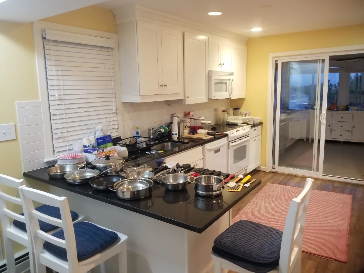 Cute white kitchen; 3 bar stools