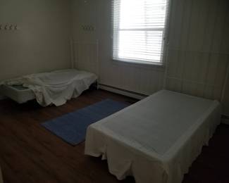 Twin box springs; white metal headboards