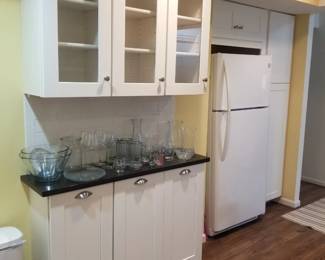 Kitchen cabintery features a pantry