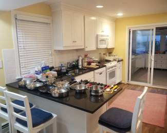 Cute white kitchen; 3 bar stools