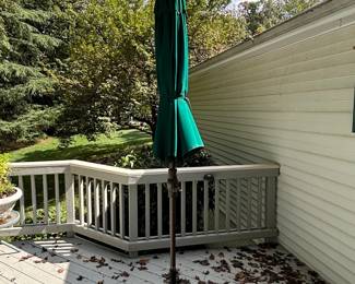 Green Patio Umbrella with Decorative Weighted Base