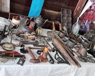 Several tables of primitives in the house and garage