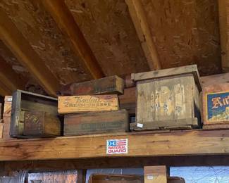 Variety of vintage wood crates and advertising crates 