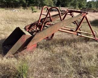 Front trip loader bucket