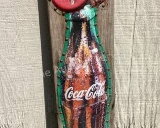 Coca-Cola sign on barnwood