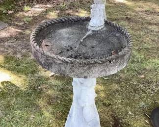 Cement birdbath with cement cardinal