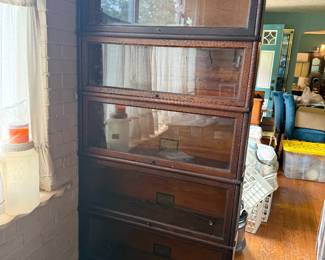 Beautiful antique Globe-Wernicke barrister bookcase with stacking oak sections and classic glass-front doors. A standout piece coming to our San Marco Estate Sale, October 2–3!