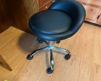 2 small black rolling stools