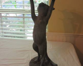 Unique cat holding up an ashtray with bird on top