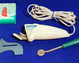Vintage electric scissors, needle, threader, and more